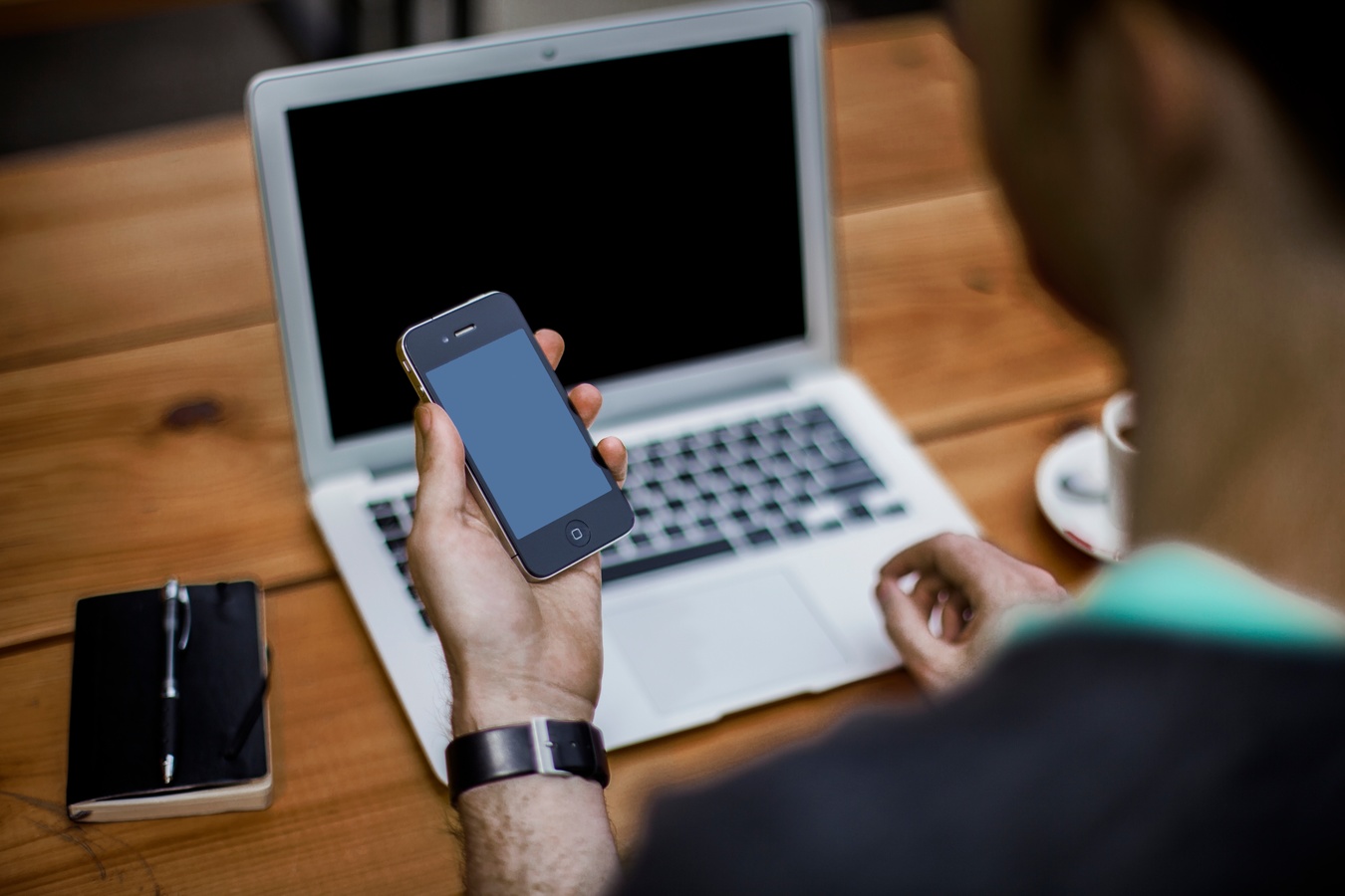 operating a smartphone and a laptop